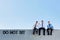 Photo of thoughtful businessmen sitting and relaxing on rooftop during break in office