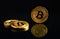 Photo of three coins of shining bitcoins btc on dark background with mirroring effect. Isolated and illuminated bitcoins on