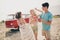Photo of three friends alcohol lovers have fun hippie festival concept wear casual outfit nature seaside beach outside