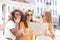 Photo of three girls enjoying sightseeing outdoor. Beautiful female tourists exploring city with map