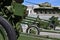 Photo of three guns of the Soviet Union of the Second World War against the background of the green tank T-3