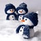 Photo of three hand made snowman in blue color