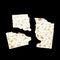 A photo of three pieces of matzah or matza isolated on black background. Matzah for the Jewish Passover holidays. Place for text,