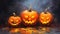 Photo of three spooky jack-o-lantern pumpkins on a Halloween-themed table