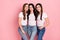Photo of three young attractive girls happy positive smile family friend hug  over pink color background