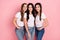 Photo of three young cheerful girls happy positive smile wear casual outfit  over pink color background