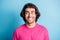 Photo of toothy smiling eastern man look empty space wear pink t-shirt isolated over blue color background