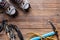 Photo on top of boots, ski poles,pickaxe, picks on wooden background.