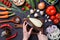 Photo on top of fresh vegetables, champignons, cutting board, oil, knife, eggplant, chef`s hands