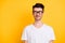 Photo of tricky funny young guy dressed white t-shirt glasses smiling looking empty space isolated yellow color