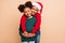 Photo of two adorable cheerful kids embrace each other wear x-mas hat jumper isolated beige color background