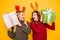 Photo of two amazed ladies received big giftboxes for xmas wear sweaters and head horns isolated yellow background