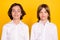 Photo of two cheerful positive classmates schoolboys look camera wear white shirt isolated yellow color background