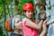 Photo of two sports women climbing up mountain