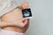 Photo ultrasound in the hands of a pregnant girl on a belly background