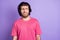 Photo of unhappy arrogant young man wear pink t-shirt looking empty space isolated violet color background