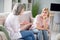 Photo of unhappy bored young woman and old lady talk sit sofa wear casual outfit indoors inside house home