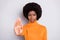 Photo of unhappy dark skin woman make stop sign hand wear orange sweater isolated on grey color background