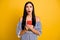 Photo of unhappy shocked young lady wear striped clothes holding modern device open mouth  yellow color