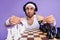 Photo of unsure brunette guy play chess wear spectacles white hair band singlet isolated on lilac color background