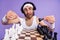 Photo of unsure brunette guy play chess wear spectacles white singlet hairband isolated on lilac color background