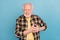 Photo of upset depressed retired man wear plaid shirt arms chest having heart attack isolated blue color background