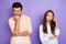 Photo of upset spouses man angry bite fist woman look copyspace annoyed isolated on violet color background