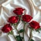 Photo Valentines charm red roses on white satin cloth background