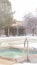 Photo Vertical frame Frozen swimming pool area surrounded by snow on a foggy and cold winter day