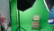 Photo or video studio with two hexagone studio lights. Green screen and fixed chair