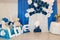 Photo wall for boy. Blue number one. Plush Teddy bears. Blue and white flowers