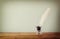 Photo of white Feather and inkwell on old wooden table