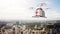 Photo White Generic Design Remote Control Air Drone Flying Sky Medical Box Under Urban Surface.Modern City Background