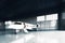 Photo of White Matte Luxury Generic Design Private Jet parking in hangar airport. Concrete floor. Business Travel
