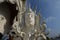 photo of a white statue in one of the temples in Thailand