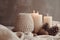 photo of winter composition lighted candles white knitted sweater pine cones and anise on a pastel backgroun