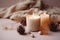 photo of winter composition lighted candles white knitted sweater pine cones and anise on a pastel backgroun