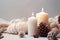 photo of winter composition lighted candles white knitted sweater pine cones and anise on a pastel backgroun