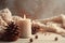 photo of winter composition lighted candles white knitted sweater pine cones and anise on a pastel backgroun