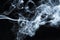 Photo of a wisp of smoke on a dark background