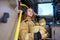 Photo of woman firefighter with helmet in hands sitting in fire truck