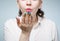 Photo of woman with rainbow manicure doing air kiss