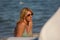 photo of a woman& x27;s face at sea, mature woman, blonde about fifty very young