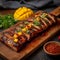 Photo Wooden plank presentation pork belly braaivleis with mango, chili sauce