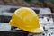 Photo Yellow hard hat safety helmet on construction site, essential gear