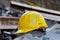 Photo Yellow hard hat safety helmet on construction site, essential gear