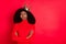 Photo of young african woman wear golden crown unhappy sad doubt crossed hands isolated over red color background