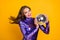 Photo of young attractive fancy girl happy positive smile hold disco ball isolated over yellow color background