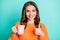 Photo of young attractive girl happy smile hold cup of coffee show thumb-up like perfect advice isolated over teal color