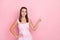 Photo of young attractive girl point finger empty space promotion advert follow sale isolated over pink color background